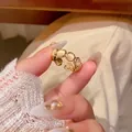Eleganter offener Goldring mit cremegelben Katzenaugensteinen und Retro-Schleifen-Design - Gold Katzenauge Reihenring (J994)