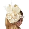 Elegant cream fascinator with linen bow, soft feathers and pearls on mannequin - Beige