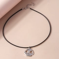 Close-up of gothic skull pendant on black braided cord with adjustable chain necklace - Skeleton Head Necklace