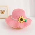 Detailed view of a cute pink straw sun hat for kids featuring a sunflower accent. - Hat / Watermelon red