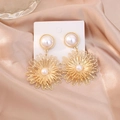 Elegant gold hollow flower drop earrings with white pearls on silk background - Style 25092909-1