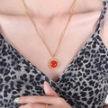 Gold twist chain necklace with a round red gemstone pendant worn by a model - Gold Color Red Turquoise Necklace / 50cm