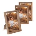 Three solid wood photo frames in light grain finish with desktop easel backs on white background - Beech Color