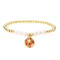 Gold beaded bracelet with pearls and a star-shaped hollow charm on white background - Red