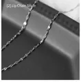 Detail shot of silver lip chain necklace with high metallic luster on dark display stand - 60 cm / Lip Chain Fine (Silver)