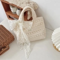 Detailed close-up of crochet lace tote bag with floral patterns and a large bow - Apricot With Flower Decoration