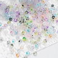 Vue macro de perles en verre colorées avec motifs floraux pour bijoux DIY et artisanat - Perles Tachetées 8mm / Multicolore