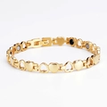 Gold magnetic therapy bracelet for women featuring heart links and healing stones - Gold