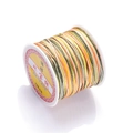 Close-up of size 72 gradient multicolor jewelry cord on a white plastic spool - Color No. 13