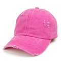 Close-up of rose red washed denim baseball cap featuring distressed holes and retro style - Rose Red