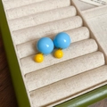 Detail of yellow and blue double-sided spherical stud earrings on beige velvet tray - 26# Silver Earring Post - Blue and Yellow - Double-sided Ball Studs