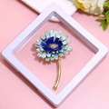 Elegant blue enamel flower brooch with gold stem in a white minimalist display frame - XZ153 Blue-Blue Daisy-Boxed