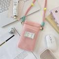 Pink mesh phone bag with adjustable cord strap and Suvakka Studio tag on white desk - Light Pink