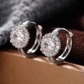 Elegant silver zircon hoop earrings with halo setting on a luxury jewelry box display - White Gold
