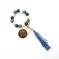 Detail of beaded keychain with leopard wood beads, blue suede tassel and Mama wood tag - Blue