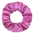 Close-up of vibrant magenta satin scrunchie with smooth silk texture and soft ruffles - Rose Red