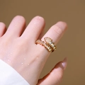 Adjustable gold plated snake ring featuring sparkling baguette and round zircon stones - Gold