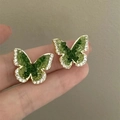 Macro view of crystal butterfly earrings with green stones and white diamonds - Real Gold Plated Emerald Butterfly