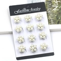 Set of 12 silver star-shaped faux pearl earrings displayed on a fashion jewelry card - KZ027-1 Pearl Star Earring Set