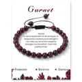 Adjustable garnet bead bracelet with black braided cord on white description card - Garnet