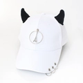 Detail of white baseball cap featuring black devil horns and silver metal rings decoration - Eiffel Tower White
