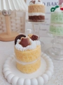 Macro shot of tiered yellow sponge cake candle with cream and star chocolate - Yellow Cake (Wood Sage & Sea Salt)