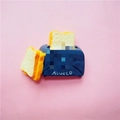 Detailed close-up of blue resin toaster miniature accessory with realistic bread detail - Bread Maker