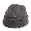 Detail of distressed grey knitted beanie with silver rings and metal safety pin accessory - M (56-58cm) / Gray