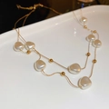 Double-layered golden necklace with irregular pearls and small beads in a vintage style - Gold Double-layer Irregular Pearl Necklace