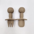 Silicone baby fork and spoon set in khaki with panda handles and safety shields - Brown