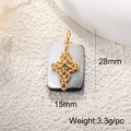 Detailed view of golden cross pendant with green gem on rectangular abalone shell base - A0317 Abalone Shell Cross