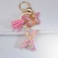 Pink sequin letter X keychain with leather tassel and resin butterfly pendant accessory - Letter X