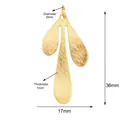Three-petal leaf golden metal pendant with brushed finish and 36x17mm dimensions - Triple Leaf / Brushed Gold