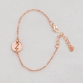 Rose gold chain bracelet with a hollow circular charm featuring the letter Z - Rose Gold Z