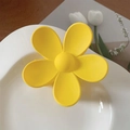 Matte yellow flower hair claw clip displayed on a white plate with floral accents - 7cm / Yellow