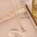 Elegant gold stainless steel necklace with a sparkling pavé zircon clover pendant - Clover (N1697-3)