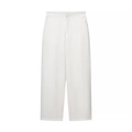 Detailed view of high-waist white wide-leg trousers in premium flowing fabric - S / White Pants