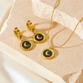 Golden round moon necklace and earrings set with black shell inlay on a stone base - Black Shell Necklace + Earrings B809-b808