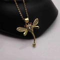 Detail of dragonfly pendant featuring gold plating, pink gems, and white zircons - Gold Dragonfly-White Zircon Pink Eyes