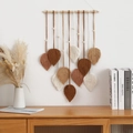 Handwoven leaf pattern macrame wall hanging in brown and beige tones on wood pole - Five Colors Ten Leaves Brown