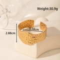 Golden wide stainless steel cuff bracelet with textured hammered design and open fit - Hammered Texture