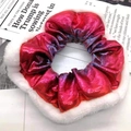 Close-up of festive holographic scrunchie with white plush trim on vintage paper - Laser Red 2#