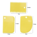 Set of 3 yellow plastic cake scrapers with varied shapes and detailed size markings - 3-Piece Small Scraper Set / Yellow