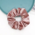 Detail of pink velvet scrunchie featuring gold foil stars and sequins on soft fabric - Pink
