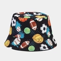 Detail view of the reversible sun hat with colorful sports ball prints on black fabric - Football Rugby