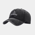 Close-up of A LOS ANGELES embroidery on a washed black cotton baseball cap surface - Adjustable / Black