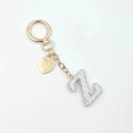 Golden keychain featuring a rhinestone letter Z and a heart pendant with engraving - Letter Z
