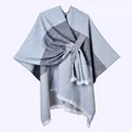 Detail of color-block knit poncho featuring grey geometric pattern and white fringe trim - Horizontal Stripe with White Fringe and Slash / Gray