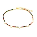 Macro shot of colorful zircon heart necklace with gold chain and lobster clasp - White Heart: Colorful Zircon