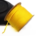 Close-up of 1.5mm yellow cotton cord neatly wound on a spool for DIY jewelry making - Approx. 1.5MM / Gold Yellow